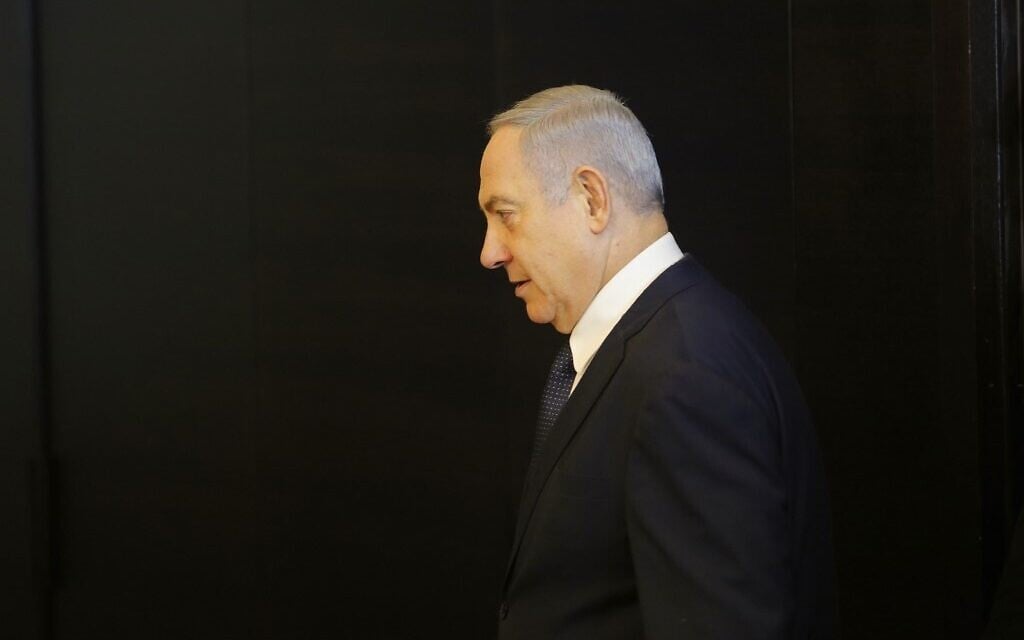 Prime Minister Benjamin Netanyahu arrives to deliver a statement regarding his intention to file a request to the Knesset for immunity from prosecution, in Jerusalem on January 1, 2020. (Gil Cohen-Magen/AFP) Prime Minister Benjamin Netanyahu arrives to deliver a statement regarding his intention to file a request to the Knesset for immunity from prosecution, in Jerusalem on January 1, 2020. (Gil Cohen-Magen/AFP)