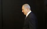Prime Minister Benjamin Netanyahu arrives to deliver a statement regarding his intention to file a request to the Knesset for immunity from prosecution, in Jerusalem on January 1, 2020. (Gil Cohen-Magen/AFP)