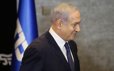Prime Minister Benjamin Netanyahu leaves a press conference in Jerusalem after announcing his intention to file a request with the Knesset for immunity from prosecution, January 1, 2020. (Gil Cohen-Magen/AFP)