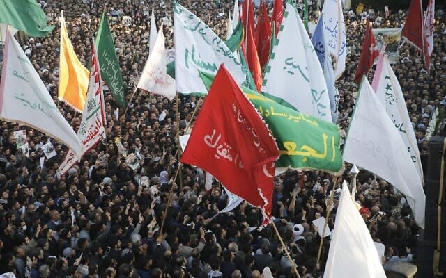 Iranians march on January 5, 2020 in the streets of the northwestern city of Ahvaz to pay homage to top general Qassem Soleimani, who was killed in a US strike in Baghdad. (HOSSEIN MERSADI/Fars News / AFP)