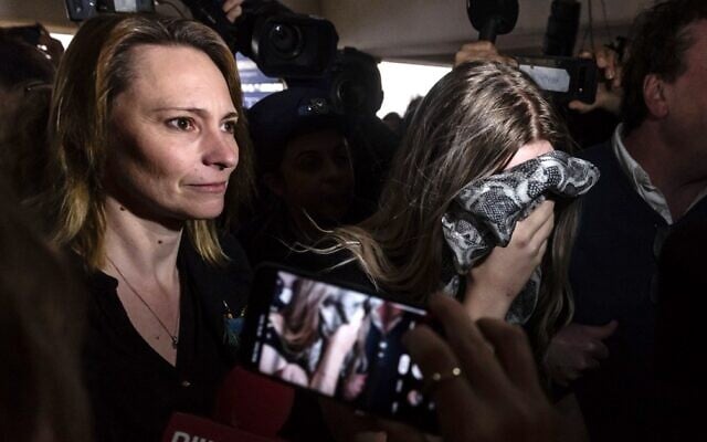 A British teenager convicted of falsely accusing a group of Israelis of gang rape covers her face as she arrives with her mother to the Famagusta District Court, in Paralimni in eastern Cyprus on January 7, 2020. (Iakovos Hatzistavrou/AFP) A British teenager convicted of falsely accusing a group of Israelis of gang rape covers her face as she arrives with her mother to the Famagusta District Court, in Paralimni in eastern Cyprus on January 7, 2020. (Iakovos Hatzistavrou/AFP)
