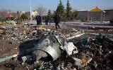 Rescue teams work amidst debris after a Ukrainian plane carrying 176 passengers crashed near Imam Khomeini airport in the Iranian capital Tehran early in the morning on January 8, 2020, killing everyone on board. (AFP)