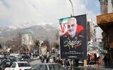 Iranians walk past a poster of slain military commander Qassem Soleimani off a main square in the Islamic Republic's capital Tehran on January 11, 2020. (Atta Kenare/AFP)