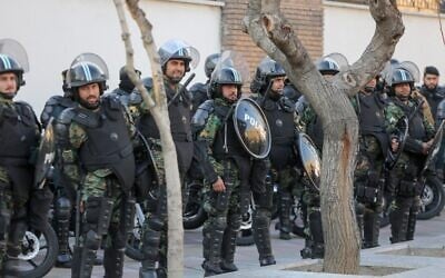 Iranian security forces stand guard in front of the British embassy in the capital Tehran on January 12, 2020 during demonstrations following the British ambassador's arrest for allegedly attending an illegal demonstration. (ATTA KENARE / AFP)