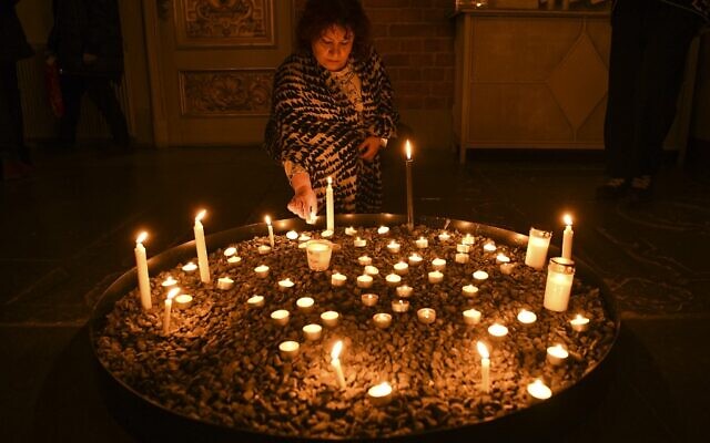 A mourner lights a candle at a memorial service for the victims of Ukrainian Airlines flight PS752 crash in Iran at Storkyrkan church in Stockholm on January 15, 2020. (Jonathan NACKSTRAND / AFP) A mourner lights a candle at a memorial service for the victims of Ukrainian Airlines flight PS752 crash in Iran at Storkyrkan church in Stockholm on January 15, 2020. (Jonathan NACKSTRAND / AFP)