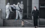 Medical staff members carry a patient into the Jinyintan hospital, before COVID-19 had been identified, in Wuhan in China's central Hubei province, January 18, 2020. (AFP)