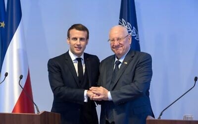 French President Emmanuel Macron (L) and President Reuven Rivlin at a press conference in Jerusalem on January 22, 2020. (Jacques Witt/Pool/AFP)