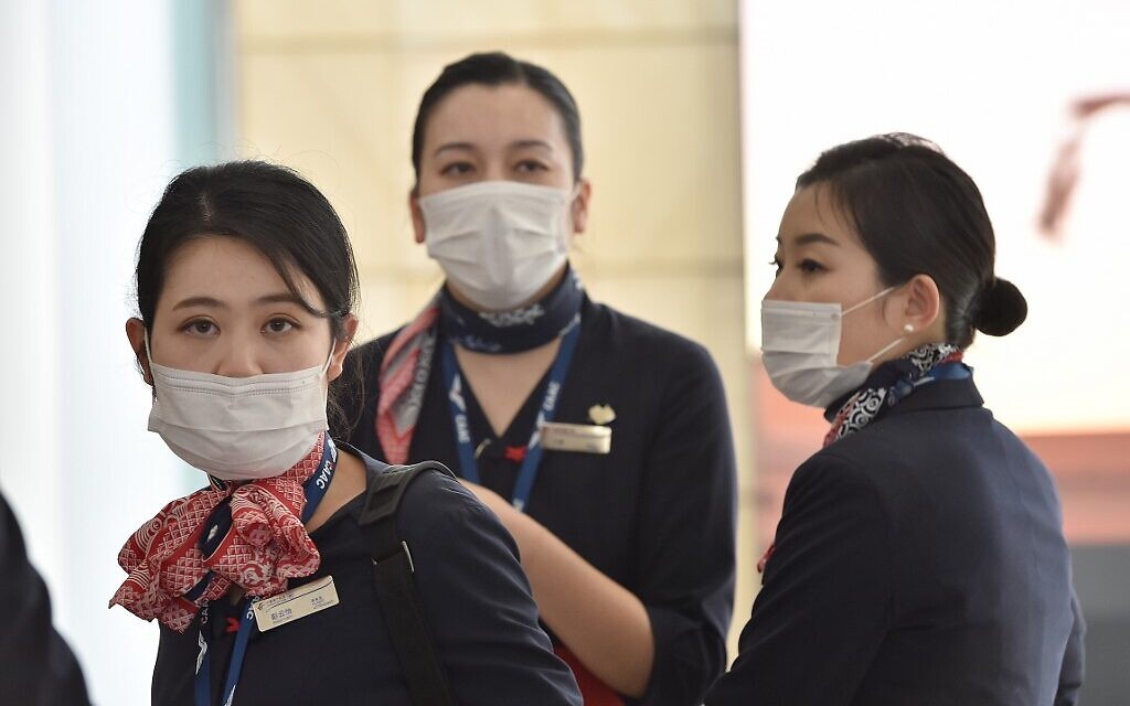 China Eastern Airlines aircrew arrive at Sydney airport after landing on a plane from Shanghai on January 25, 2020. (Peter Parks/AFP) China Eastern Airlines aircrew arrive at Sydney airport after landing on a plane from Shanghai on January 25, 2020. (Peter Parks/AFP)