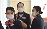 China Eastern Airlines aircrew arrive at Sydney airport after landing on a plane from Shanghai on January 25, 2020. (Peter Parks/AFP)