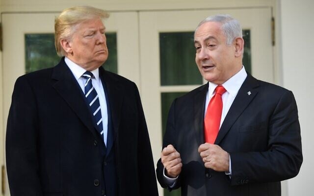 US President Donald Trump greets Prime Minister Benjamin Netanyahu as he arrives for a meeting on the South Lawn of the White House in Washington, DC, January 27, 2020. (Saul Loeb/AFP) US President Donald Trump greets Prime Minister Benjamin Netanyahu as he arrives for a meeting on the South Lawn of the White House in Washington, DC, January 27, 2020. (Saul Loeb/AFP)