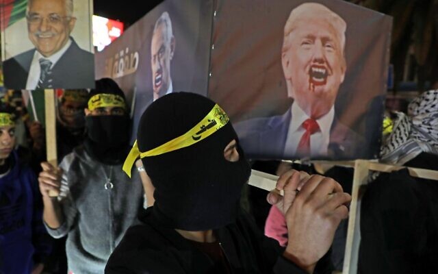 Palestinians carry a mock coffin bearing the portrait of US President Donald Trump during a demonstration in the West Bank city of Nablus on January 28, 2020. (Jaafar ASHTIYEH / AFP) Palestinians carry a mock coffin bearing the portrait of US President Donald Trump during a demonstration in the West Bank city of Nablus on January 28, 2020. (Jaafar ASHTIYEH / AFP)