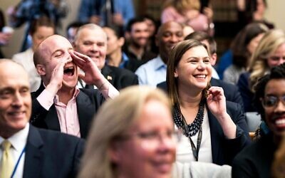 Max Rose, left, and Elissa Slotkin cheer on fellow House freshman in an office lottery on Capitol Hill, November 30, 2018. (Melina Mara/The Washington Post via Getty Images via JTA)