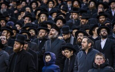 Orthodox Jews attend the 13th Siyum HaShas, a celebration marking the completion of the Daf Yomi, at the MetLife Stadium on January 1, 2020 in East Rutherford, New Jersey. Security was tightened at the event, where the Talmud is read in its entirety, after a rise in anti-Semitic incidents in the area.   (Eduardo Munoz Alvarez/Getty Images/AFP)