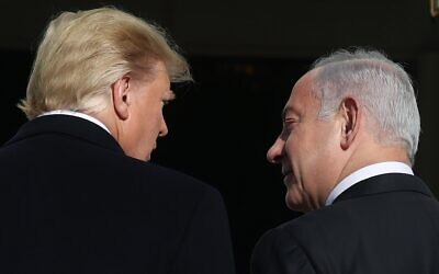 US President Donald Trump (L) welcomes Prime Minister Benjamin Netanyahu at the White House on January 27, 2020, in Washington, DC (Mark Wilson/Getty Images/AFP)