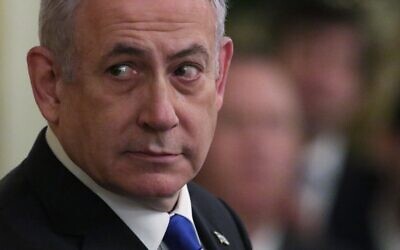 Prime Minister Benjamin Netanyahu attends a press conference with US President Donald Trump in the East Room of the White House on January 28, 2020, in Washington, DC. (Alex Wong/Getty Images/AFP)