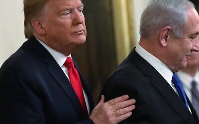 President Donald Trump and Prime Minister Benjamin Netanyahu attend a press event in the East Room of the White House, at which Trump released details of his administration's plan to resolve the Israeli-Palestinian conflict, on January 28, 2020. (Alex Wong/Getty Images/AFP)