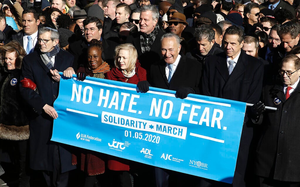 From right: Rep. Jerrold Nadler, Gov. Andrew Cuomo, Sen. Chuck Schumer, Mayor Bill de Blasio and Sen. Kirsten Gillibrand hold a banner at the march against anti-Semitism in New York City, January 5, 2020. (John Lamparski/Echoes Wire/Barcroft Media via JTA) From right: Rep. Jerrold Nadler, Gov. Andrew Cuomo, Sen. Chuck Schumer, Mayor Bill de Blasio and Sen. Kirsten Gillibrand hold a banner at the march against anti-Semitism in New York City, January 5, 2020. (John Lamparski/Echoes Wire/Barcroft Media via JTA)