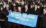 From right: Rep. Jerrold Nadler, Gov. Andrew Cuomo, Sen. Chuck Schumer, Mayor Bill de Blasio and Sen. Kirsten Gillibrand hold a banner at the march against anti-Semitism in New York City, January 5, 2020. (John Lamparski/Echoes Wire/Barcroft Media via JTA)