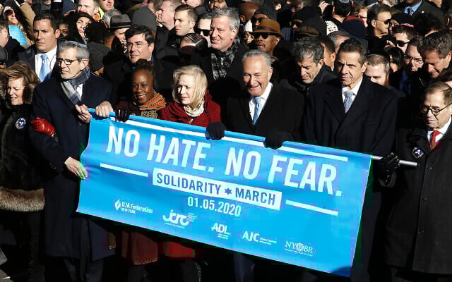 From right: Rep. Jerrold Nadler, Gov. Andrew Cuomo, Sen. Chuck Schumer, Mayor Bill de Blasio and Sen. Kirsten Gillibrand hold a banner at the march against anti-Semitism in New York City, January 5, 2020. (John Lamparski/Echoes Wire/Barcroft Media via JTA) From right: Rep. Jerrold Nadler, Gov. Andrew Cuomo, Sen. Chuck Schumer, Mayor Bill de Blasio and Sen. Kirsten Gillibrand hold a banner at the march against anti-Semitism in New York City, January 5, 2020. (John Lamparski/Echoes Wire/Barcroft Media via JTA)