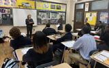Amy Goldberg, left, and Lindsay Bressman talking to students at Bishop Loughlin Memorial High School in Brooklyn, January 8, 2020. (Josefin Dolsten/ JTA)