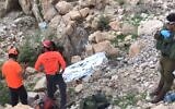 Rescue workers retrieve the body of a  70-year old hiker who died after falling off a cliff at a nature reserve near the Dead Sea on Thursday. (Screenshot)