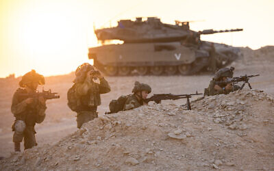 Illustrative. Infantry soldiers take aim in front of a tank during an exercise in southern Israel on August 14, 2017. (Cpl. Eden Briand/Israel Defense Forces/Flickr)