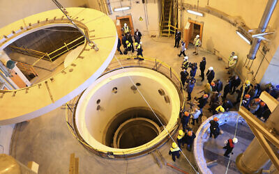 Technicians work at the Arak heavy water reactor's secondary circuit, as officials and media visit the site, near Arak, 150 miles (250 kilometers) southwest of the capital Tehran, Iran, December 23, 2019. (Atomic Energy Organization of Iran via AP)