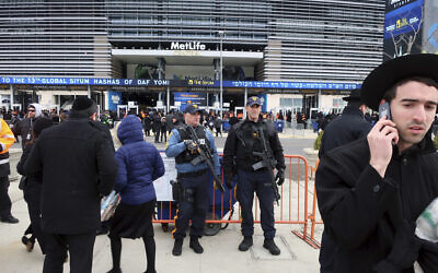 New Jersey State Police officers stand guard in front of MetLife Stadium Wednesday, Jan. 1, 2020, in East Rutherford, N.J., at an event called Siyum HaShas (AP Photo/Ted Shaffrey)