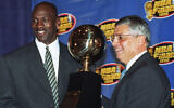 In this June 18, 1996, file photo, Chicago Bulls' Michael Jordan, left, receives the NBA Finals Most Valuable Player trophy from Commissioner David Stern during a ceremony in Chicago. David Stern, who spent 30 years as the NBA's longest-serving commissioner and oversaw its growth into a global power, (AP Photo/Charles Bennett, File)