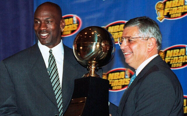 In this June 18, 1996, file photo, Chicago Bulls' Michael Jordan, left, receives the NBA Finals Most Valuable Player trophy from Commissioner David Stern during a ceremony in Chicago. David Stern, who spent 30 years as the NBA's longest-serving commissioner and oversaw its growth into a global power, (AP Photo/Charles Bennett, File) In this June 18, 1996, file photo, Chicago Bulls' Michael Jordan, left, receives the NBA Finals Most Valuable Player trophy from Commissioner David Stern during a ceremony in Chicago. David Stern, who spent 30 years as the NBA's longest-serving commissioner and oversaw its growth into a global power, (AP Photo/Charles Bennett, File)