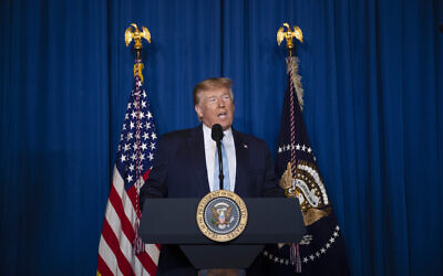 US President Donald Trump delivers remarks on Iran, at his Mar-a-Lago property, Friday, Jan. 3, 2020, in Palm Beach, Fla. (AP Photo/ Evan Vucci)