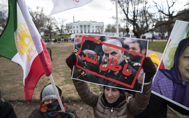 Supporters of the Mujahedeen-e-Khalq, or the MEK, an Iranian exile group, hold signs and flags during a show of support for a US airstrike in Iraq that killed Iranian Gen. Qassem Soleimani, in Lafayette Park across from the White House, Sunday, Jan. 5, 2020, in Washington. (AP Photo/Alex Brandon) Supporters of the Mujahedeen-e-Khalq, or the MEK, an Iranian exile group, hold signs and flags during a show of support for a US airstrike in Iraq that killed Iranian Gen. Qassem Soleimani, in Lafayette Park across from the White House, Sunday, Jan. 5, 2020, in Washington. (AP Photo/Alex Brandon)