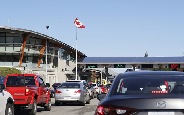 In this Oct. 9, 2019 photo, traffic enters Canada from the United States at the Peace Arch Border Crossing, in Blaine, Wash. The Washington state chapter of the Council on American-Islamic Relations says more than 60 Iranians and Iranian-Americans were detained and questioned at the border crossing over the weekend. (AP Photo/Elaine Thompson) In this Oct. 9, 2019 photo, traffic enters Canada from the United States at the Peace Arch Border Crossing, in Blaine, Wash. The Washington state chapter of the Council on American-Islamic Relations says more than 60 Iranians and Iranian-Americans were detained and questioned at the border crossing over the weekend. (AP Photo/Elaine Thompson)