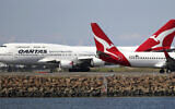 Illustrative: Two Qantas planes taxi on the runway at Sydney Airport in Sydney, Australia, August 20, 2015. (Rick Rycroft/AP)