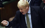 In this handout photo provided by the House of Commons, Britain's Prime Minister Boris Johnson gestures during the first Prime Minister's Questions of the year, in the House of Commons in London, January 8, 2020. (Jessica Taylor/House of Commons via AP)