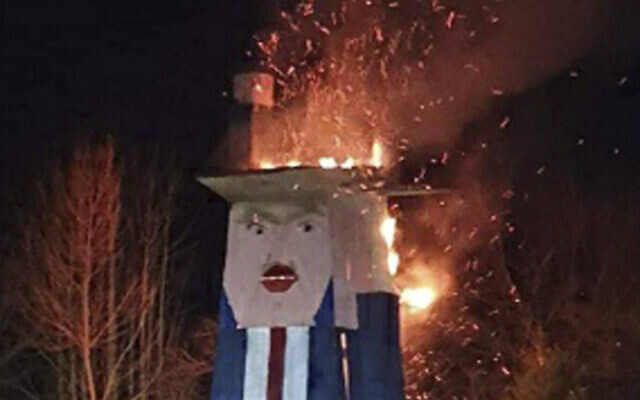 In this photo provided by the municipality of Moravce, wooden sculpture resembling US president Trump is on fire, in Moravce, Slovenia, January 9, 2020. (Municipality of Moravce via AP) In this photo provided by the municipality of Moravce, wooden sculpture resembling US president Trump is on fire, in Moravce, Slovenia, January 9, 2020. (Municipality of Moravce via AP)