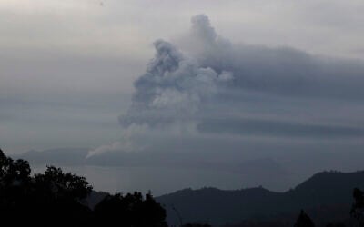Taal Volcano spews ash on Monday Jan. 13, 2020, in Tagaytay, Cavite province, south of Manila, Philippines.  (AP Photo/Aaron Favila)
