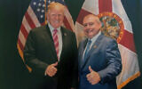 This undated image released by the US House Judiciary Committee from documents provided by Lev Parnas to the committee in the impeachment probe against President Donald Trump, shows a photo of Lev Parnas with Trump in Florida. (House Judiciary Committee via AP)