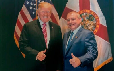 This undated image released by the US House Judiciary Committee from documents provided by Lev Parnas to the committee in the impeachment probe against President Donald Trump, shows a photo of Lev Parnas with Trump in Florida. (House Judiciary Committee via AP)