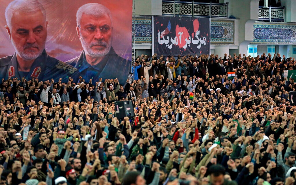In this picture released by the official website of the office of the Iranian supreme leader, worshippers chant slogans during Friday prayers ceremony, as a banner show Iranian Revolutionary Guard Gen. Qassem Soleimani, left, and Iraqi Shiite senior militia commander Abu Mahdi al-Muhandis, who were killed in Iraq in a US drone attack on January 3, 2020, and a banner which reads in Persian: "Death To America, "at Imam Khomeini Grand Mosque in Tehran, Iran, Friday, January 17, 2020. (Office of the Iranian Supreme Leader via AP) In this picture released by the official website of the office of the Iranian supreme leader, worshippers chant slogans during Friday prayers ceremony, as a banner show Iranian Revolutionary Guard Gen. Qassem Soleimani, left, and Iraqi Shiite senior militia commander Abu Mahdi al-Muhandis, who were killed in Iraq in a US drone attack on January 3, 2020, and a banner which reads in Persian: "Death To America, "at Imam Khomeini Grand Mosque in Tehran, Iran, Friday, January 17, 2020. (Office of the Iranian Supreme Leader via AP)