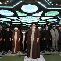 In this photo released by the official website of the office of the Iranian supreme leader, Supreme Leader Ayatollah Ali Khamenei, center, leads the Friday prayers at Imam Khomeini Grand Mosque in Tehran, Iran, Friday, Jan. 17, 2020.  (Office of the Iranian Supreme Leader via AP)