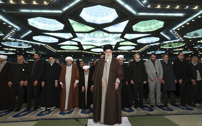 In this photo released by the official website of the office of the Iranian supreme leader, Supreme Leader Ayatollah Ali Khamenei, center, leads the Friday prayers at Imam Khomeini Grand Mosque in Tehran, Iran, Friday, Jan. 17, 2020.  (Office of the Iranian Supreme Leader via AP)