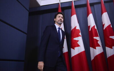 Canada Prime Minister Justin Trudeau arrives at a press conference at the National Press Theatre in Ottawa, January 17, 2020. (Sean Kilpatrick/The Canadian Press via AP)