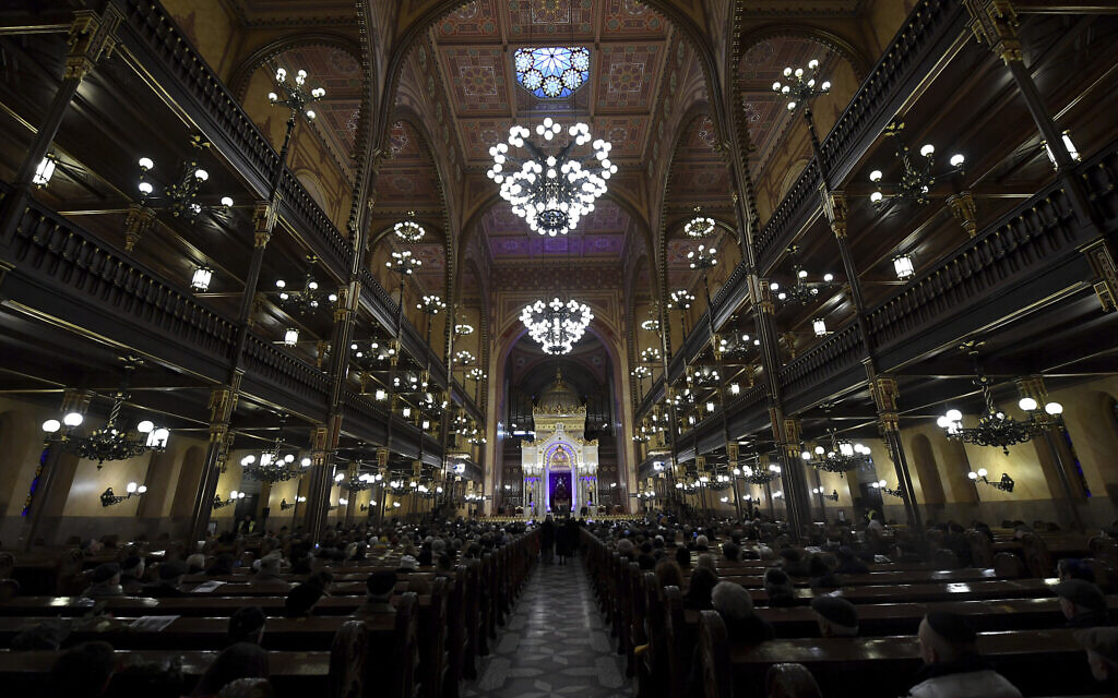 Illustrative: People attend a ceremony that commemorates the 75th anniversary of the liberation of the Budapest Jewish ghetto in Dohany Street Synagogue in Budapest, Hungary on January 19, 2020. (Tibor Illyes/MTI via AP) Illustrative: People attend a ceremony that commemorates the 75th anniversary of the liberation of the Budapest Jewish ghetto in Dohany Street Synagogue in Budapest, Hungary on January 19, 2020. (Tibor Illyes/MTI via AP)