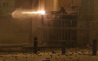 Riot police fire rubber bullets against the anti-government protesters, during ongoing protests against the political elites who have ruled the country for decades, in Beirut, Lebanon, Sunday, Jan. 19, 2020. (AP Photo/Hassan Ammar) Riot police fire rubber bullets against the anti-government protesters, during ongoing protests against the political elites who have ruled the country for decades, in Beirut, Lebanon, Sunday, Jan. 19, 2020. (AP Photo/Hassan Ammar)