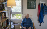 Holocaust survivor Maurice Gluck, poses for a photo in his home in Ya'ad, northern Israel, January 17, 2020. (Ariel Schalit/AP)