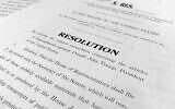 A copy of a Senate draft resolution to be offered by Senate Majority Leader Mitch McConnell, Republican-Kentucky, regarding the procedures during the impeachment trial of US President Donald Trump in Washington, January. 20, 2020. (Jon Elswick/AP)