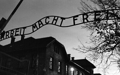 The main entrance at the former Nazi death camp of Auschwitz in Oswiecim, Poland, with the inscription, 'Arbeit Macht Frei', which translates into English as 'Work will set you Free,' December 8, 2019. (Markus Schreiber/AP)