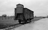 A wagon stands on the railway tracks from where hundreds of thousands of people were directed to the gas chambers to be murdered inside the former Nazi death camp of Auschwitz-Birkenau or Auschwitz II, in Oswiecim, Poland, December 8, 2019. (Markus Schreiber/AP)