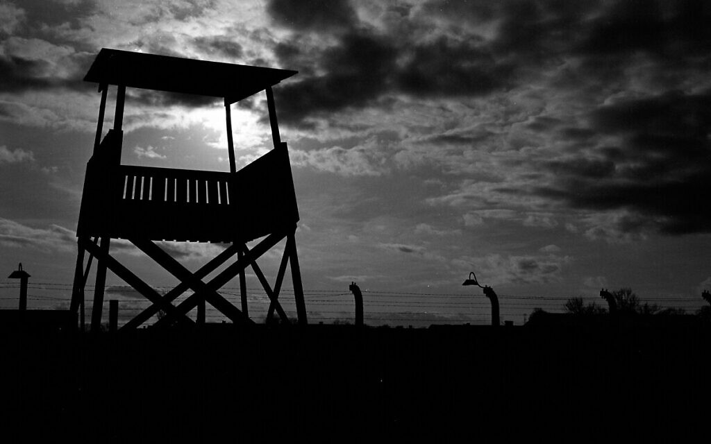 An observation tower stands inside the former Nazi death camp of Auschwitz Birkenau or Auschwitz II in Oswiecim, Poland, December 8, 2019. (Markus Schreiber/AP)